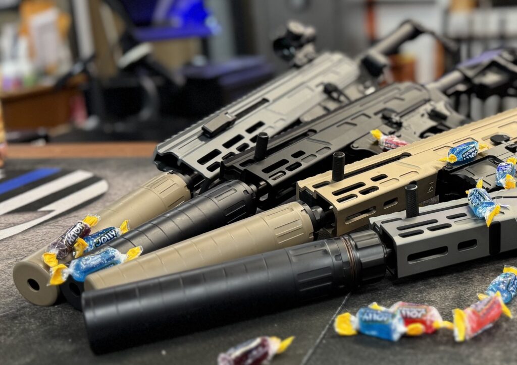 Suppressed custom builds on the counter at M E Arms